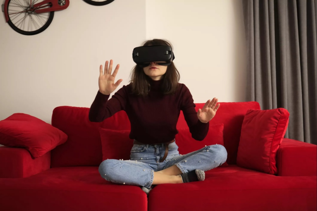 Image of a woman on a couch doing VR therapy